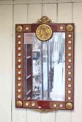 Continental rectangular bevelled wall mirror, the frame decorated with brass and porcelain roundels,