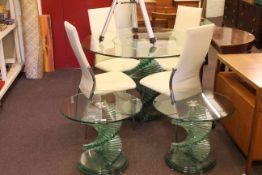Contemporary circular glass topped dining table and four chairs and pair of matching circular