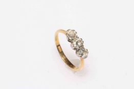 Three stone diamond and 18 carat gold ring, size O.