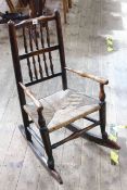 19th Century rustic rush seated child's rocking chair.