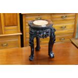 Oriental hardwood and marble inset jardiniere stand, 31cm by 20cm diameter.