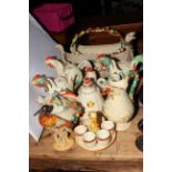 Collection of Clarice Cliff (and copies?), twelve pieces including hen teapots, weave teapot,