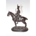Bronzed dressed military man on horseback, mounted on a marble plinth, 57cm.