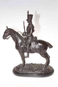 Bronzed dressed military man on horseback, mounted on a marble plinth, 57cm.