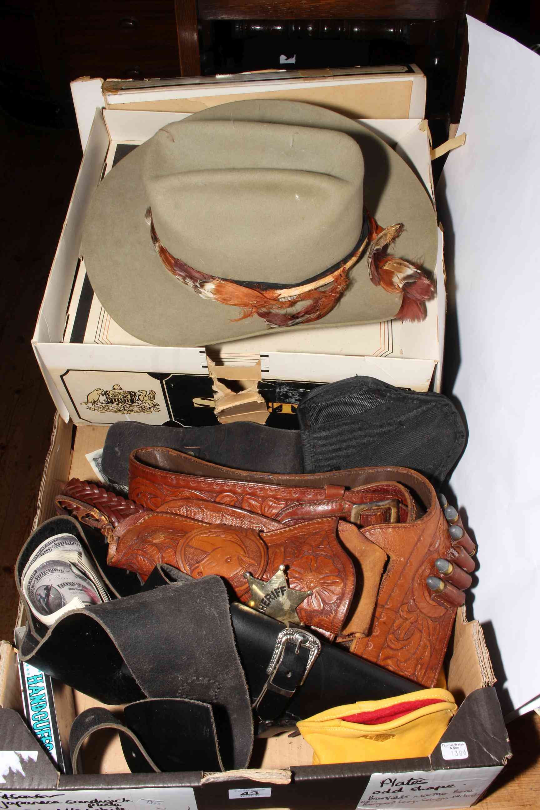 Stetson cowboy hat, gun belts and holsters, etc.