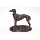 Bronze greyhound with neckerchief, 26cm high.