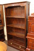 Four tier open bookcase with two base drawers, 180cm by 96cm by 33cm.