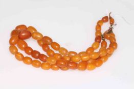 Double strand necklace of amber beads, 41cm length.