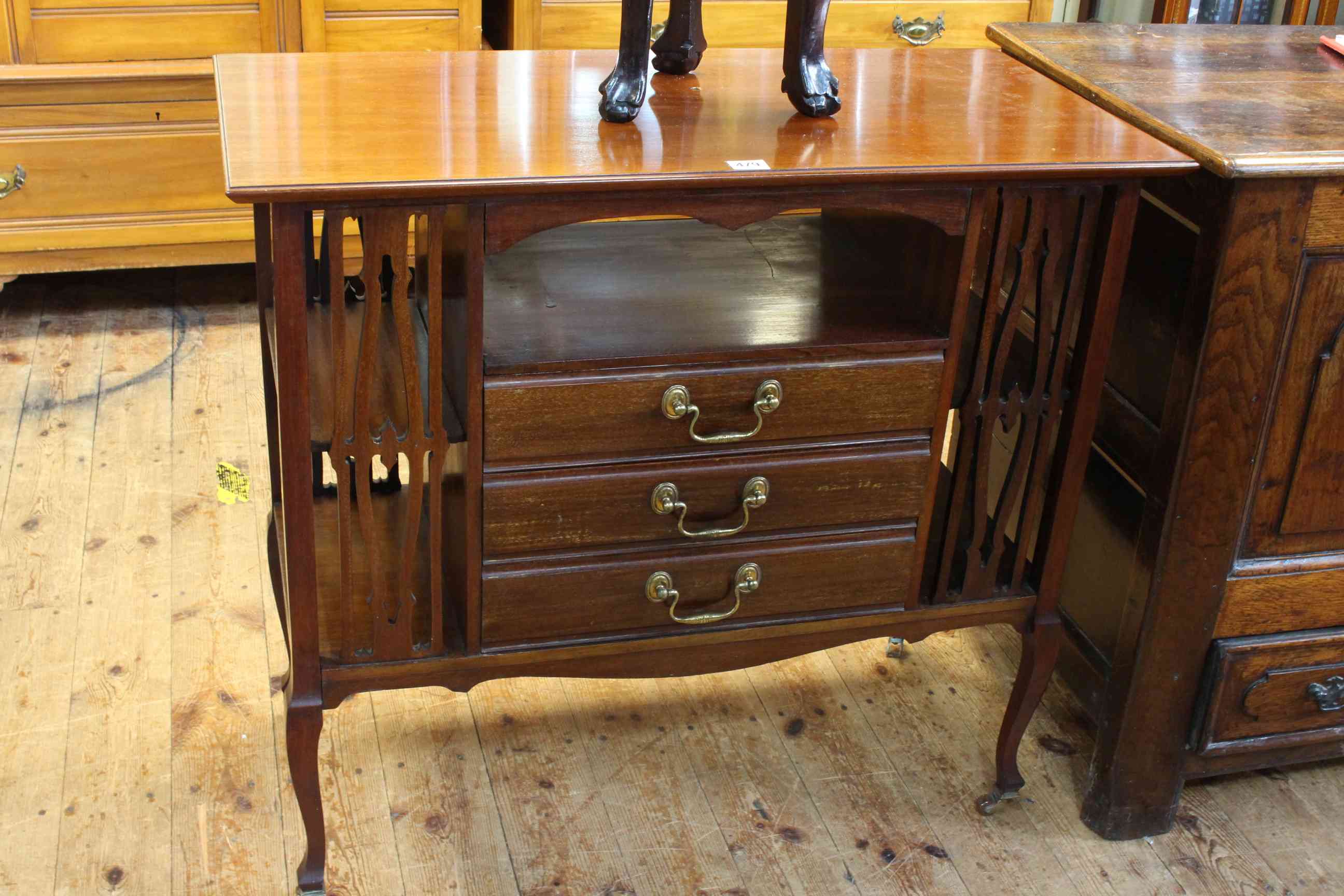 Edwardian mahogany three drawer music cabinet with fretwork panels, 76.5cm by 84cm by 42cm.