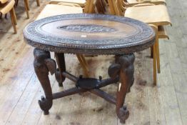 Oval carved rosewood Indian elephant table, 75cm by 93cm by 60cm.