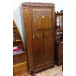 Carved oak hall wardrobe, 188cm by 89cm by 41cm.