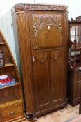 Carved oak hall wardrobe, 188cm by 89cm by 41cm.