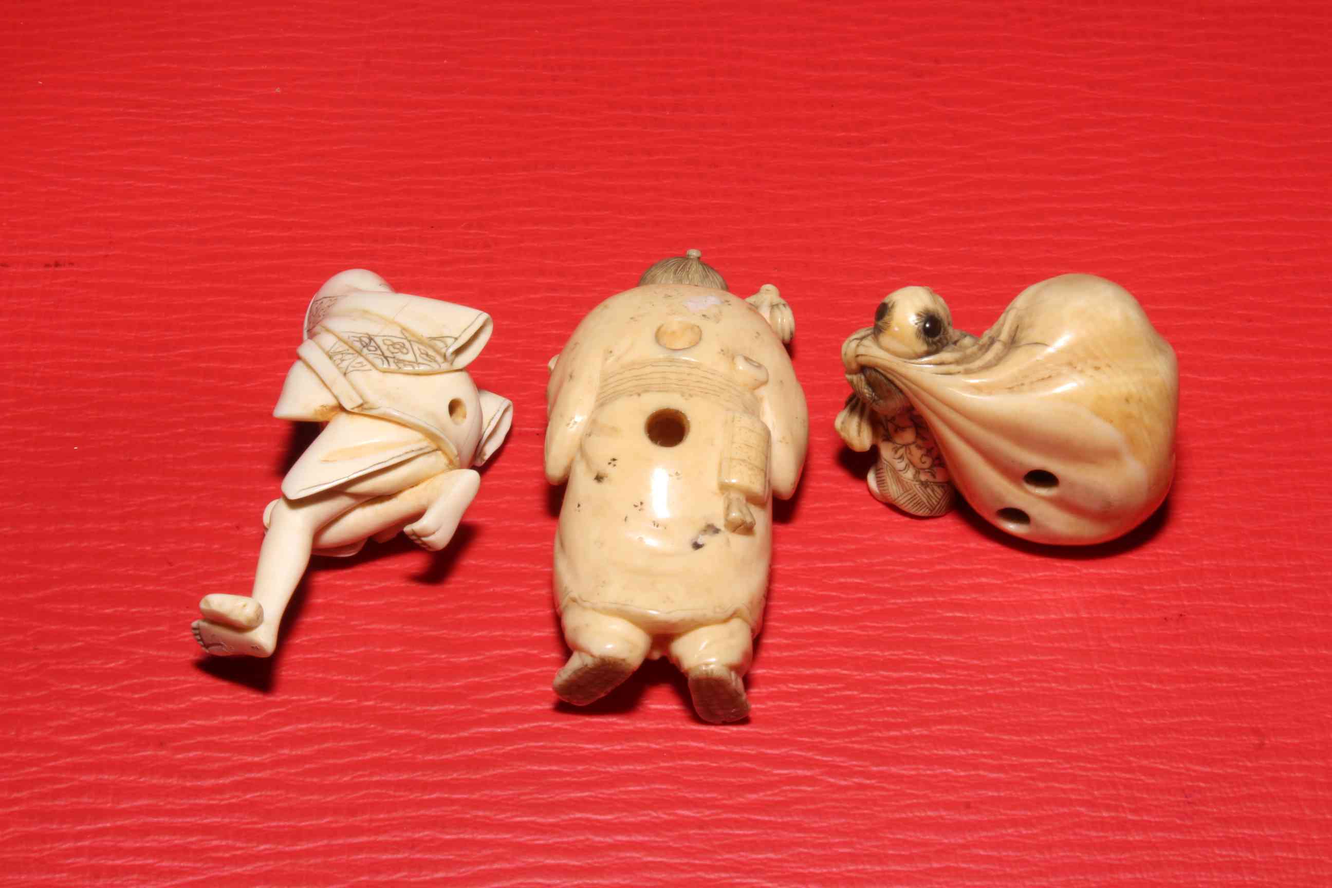 Three Japanese ivory netsuke including signed figure with fan, 6cm. - Image 2 of 2