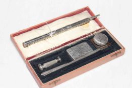 Boxed silver (unmarked) desk set with inkwell, pen, etc, along with propelling instrument (2).