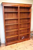 Mahogany six tier open bookcase with ten adjustable shelves, 199cm by 152cm by 35cm.