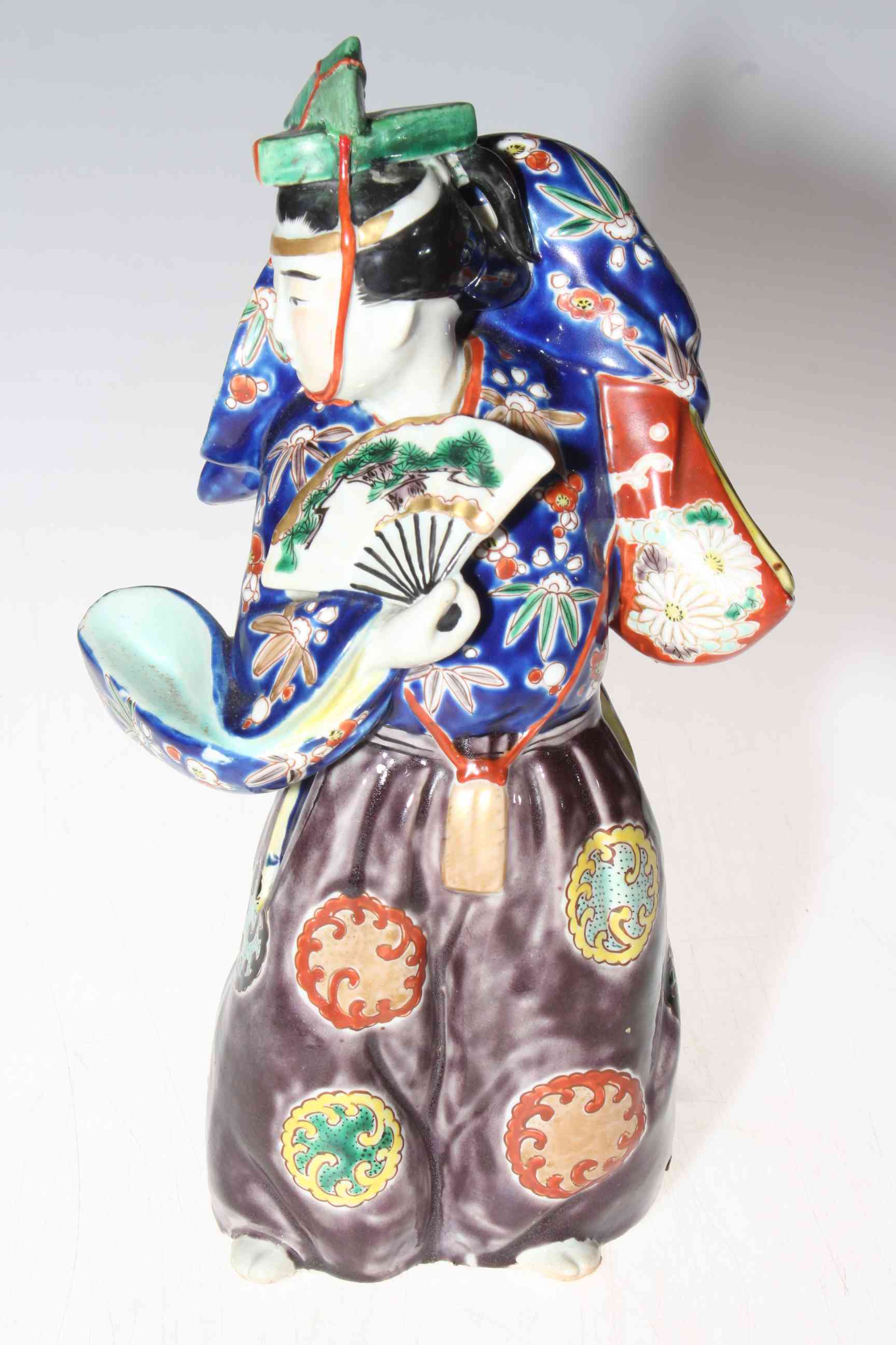 Japanese polychrome porcelain figure.