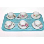 Set of six Meissen cabinet cups and saucers, each with floral designs.