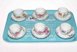 Set of six Meissen cabinet cups and saucers, each with floral designs.