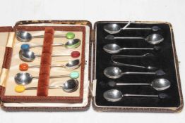 Two boxed sets of silver coffee bean spoons.