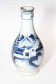 Antique Chinese blue and white bottle neck vase decorated with landscape scene, 21cm high.