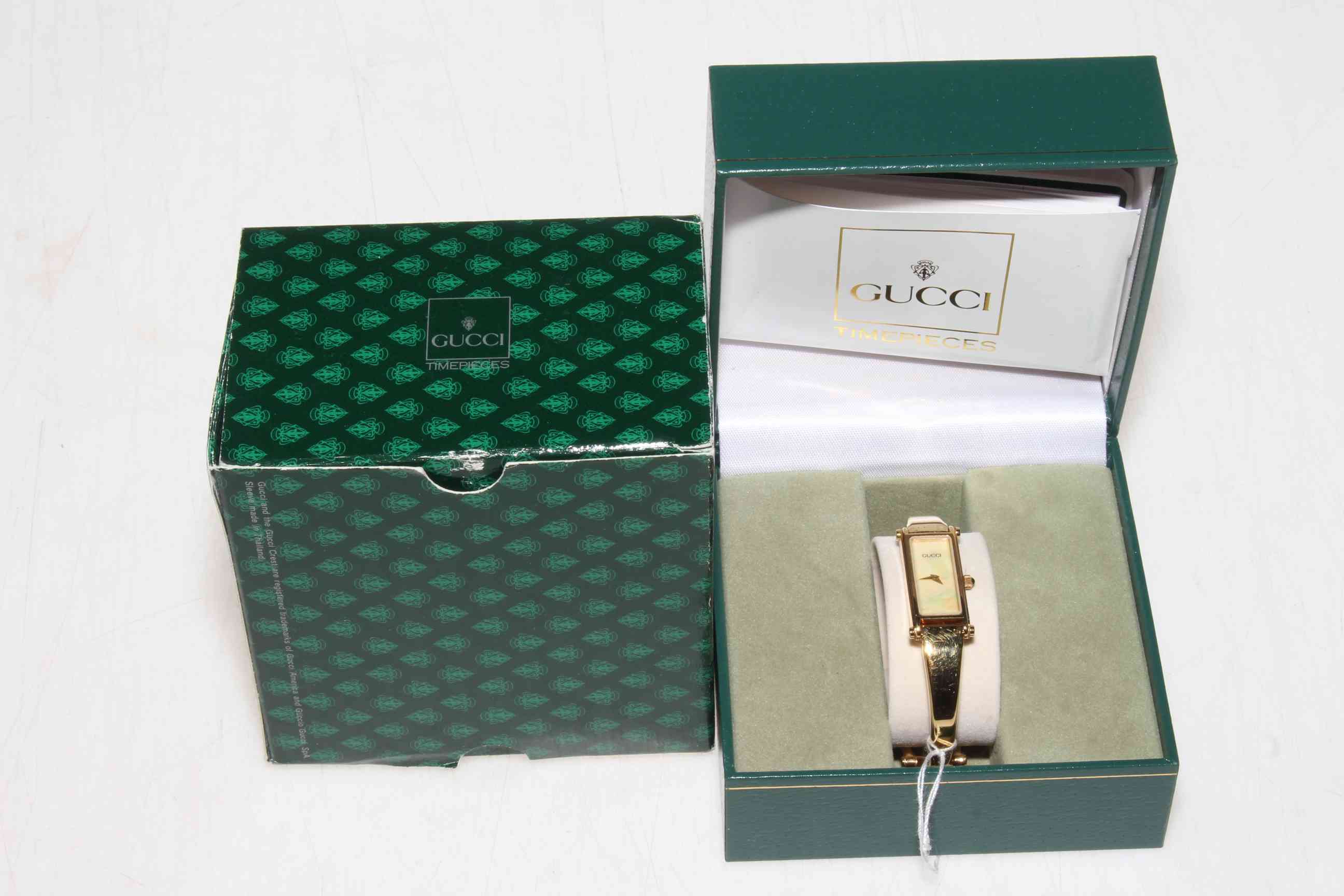 Ladies Gucci wristwatch, boxed with papers.