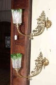 Pair of ornate brass wall lights with green tinted etched glass shades.