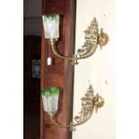 Pair of ornate brass wall lights with green tinted etched glass shades.
