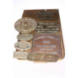 Collection of various brass and bronze plaques.