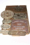 Collection of various brass and bronze plaques.