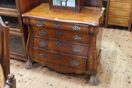 Antique oak and marquetry inlaid four drawer serpentine front chest on substantial ball and claw