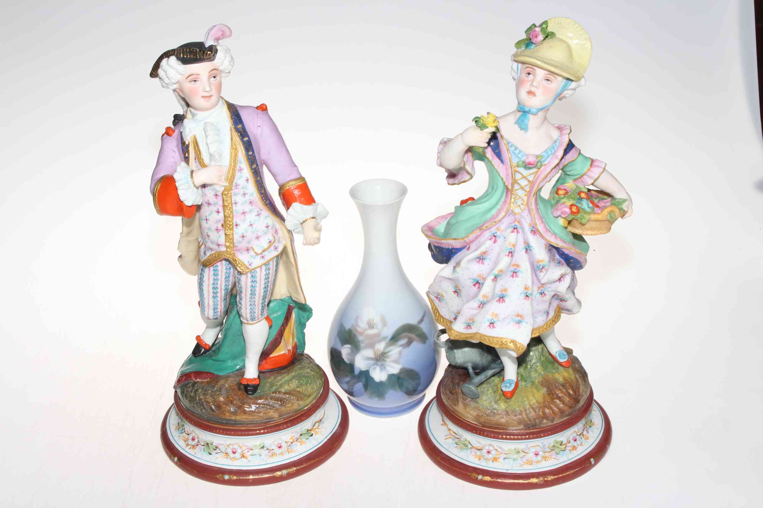 Pair Victorian bisque figures of colourful maiden and gallant, 36cm,