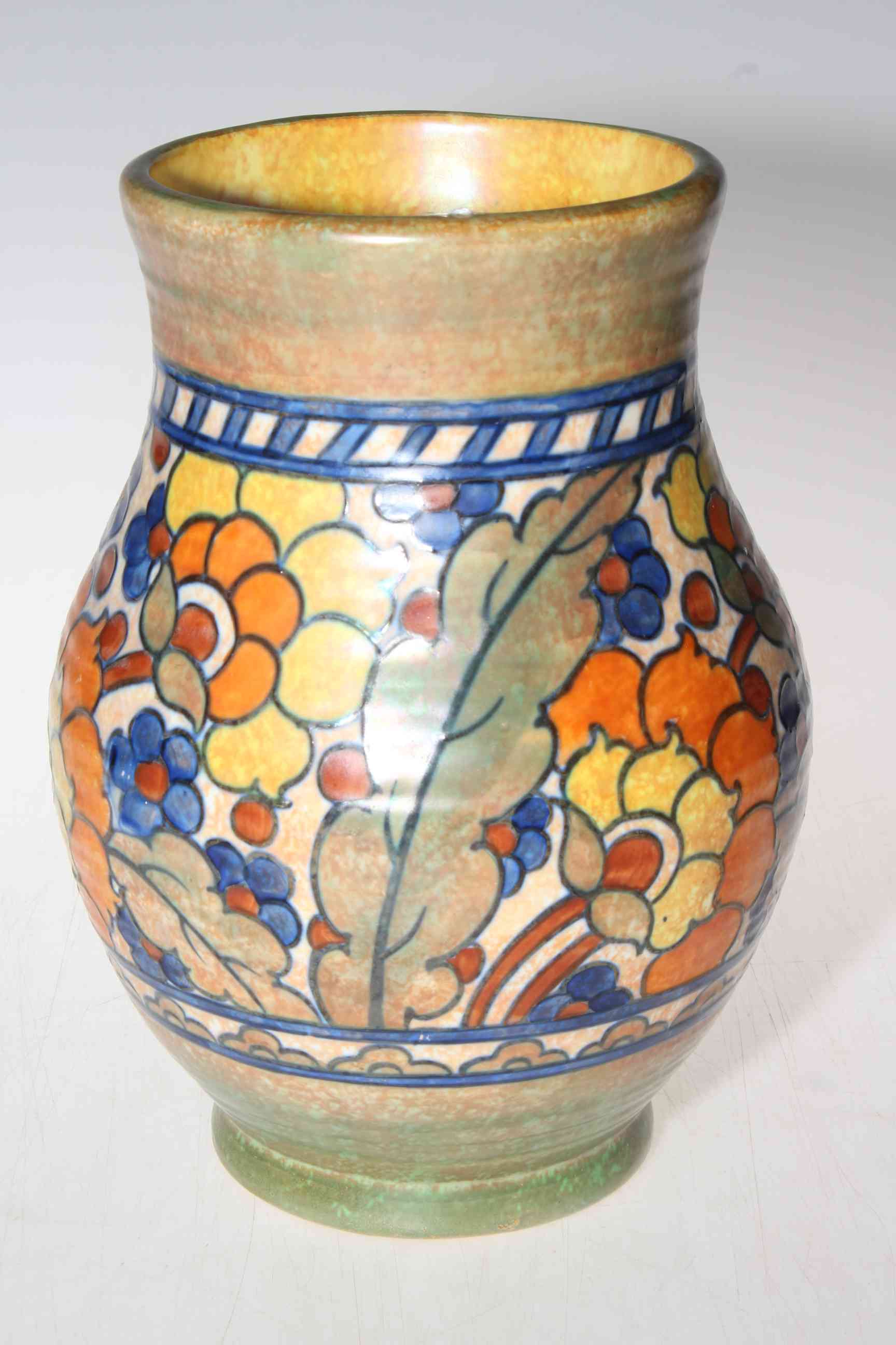 Crown Ducal Charlotte Rhead vase of ovoid form, decorated with flowers and leaves, 26cm high.
