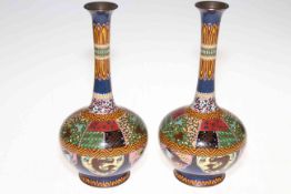 Pair of Japanese cloisonne long neck vases decorated with Phoenix, Dragons, flora, etc, 24cm high.