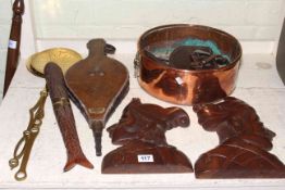 Brass and copper two handled pot, bellows, carved wooden plaques, bed pan, etc.