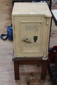 The Victoria Safe Co safe and key on inset wood stand, 85cm by 40cm by 41cm including stand.