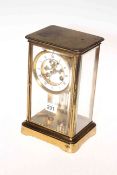 Brass mantel clock with enamel dial and Mercury pendulum, 26cm high.