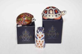 Three Royal Crown Derby paperweights including Tortoise, Orchard Hedgehog and a Meerkat.