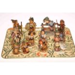 Collection of twelve Hummel figures including Skier, Apple Tree Boy & Girl,