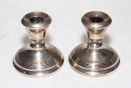 Pair of silver dwarf candlesticks, Birmingham 1932, 8.5cm high.