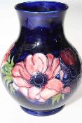 Moorcroft Pottery ovoid vase decorated with anemone on blue ground, 24cm.