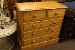 Pine chest of two short above three long drawers, 90cm by 94cm by 42cm.