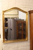 Rectangular inset glazed top coffee table and arched top gilt framed bevelled wall mirror (2).