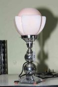 Art Deco style table lamp with pink shade.