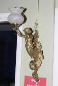 Pair of gilt metal ornate lady wall lights with frosted glass shades, approximately 58cm.