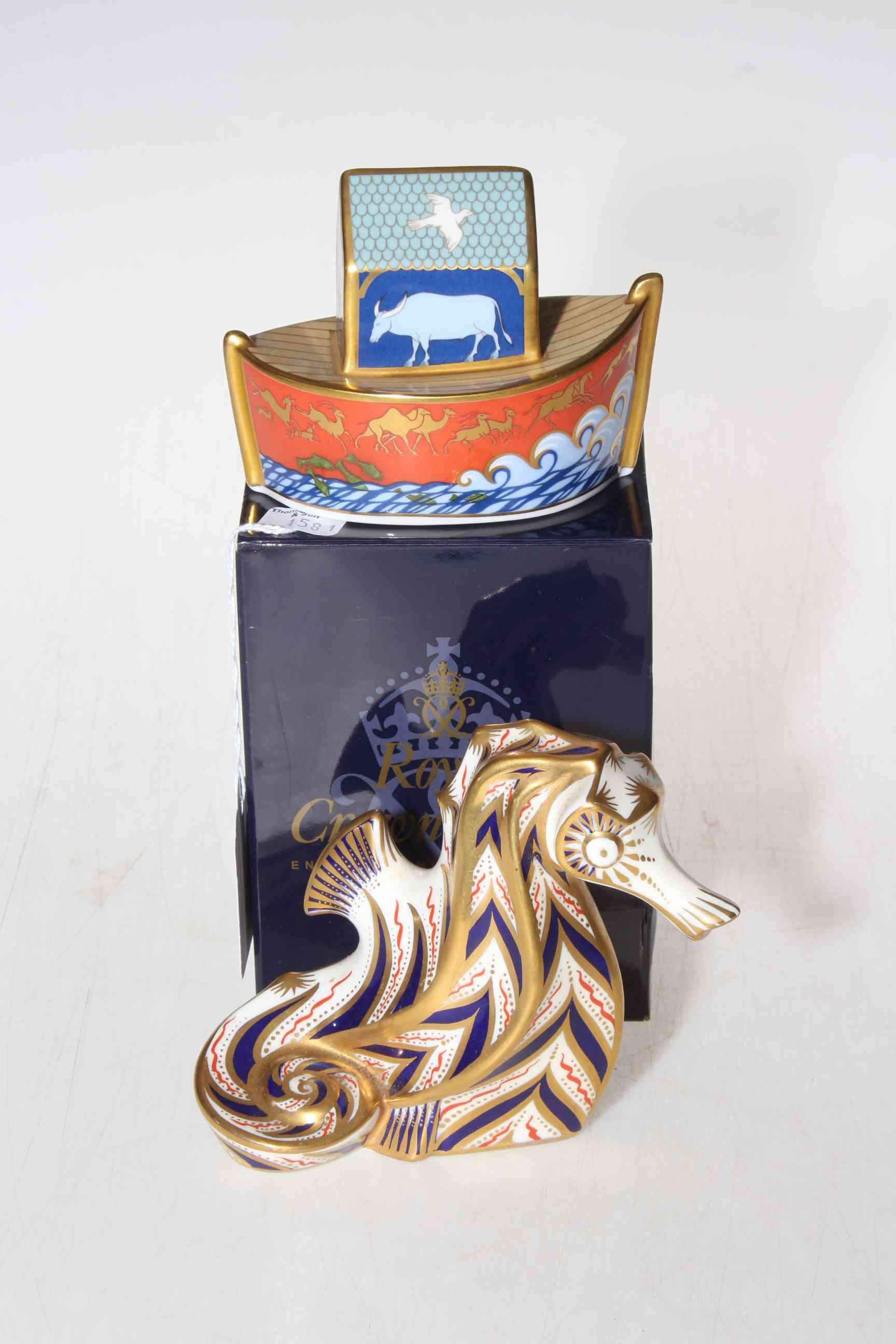 Two Royal Crown Derby paperweights, Noah's Ark and Seahorse.