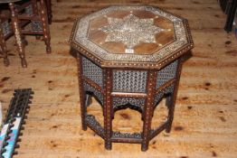 Octagonal Hoshiarpur bone inlaid rosewood low table on fretwork panelled folding base, 52cm by 51cm.