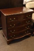 J. Sydney Smith mahogany four drawer serpentine front chest on bracket feet, 78cm by 71cm by 46cm.