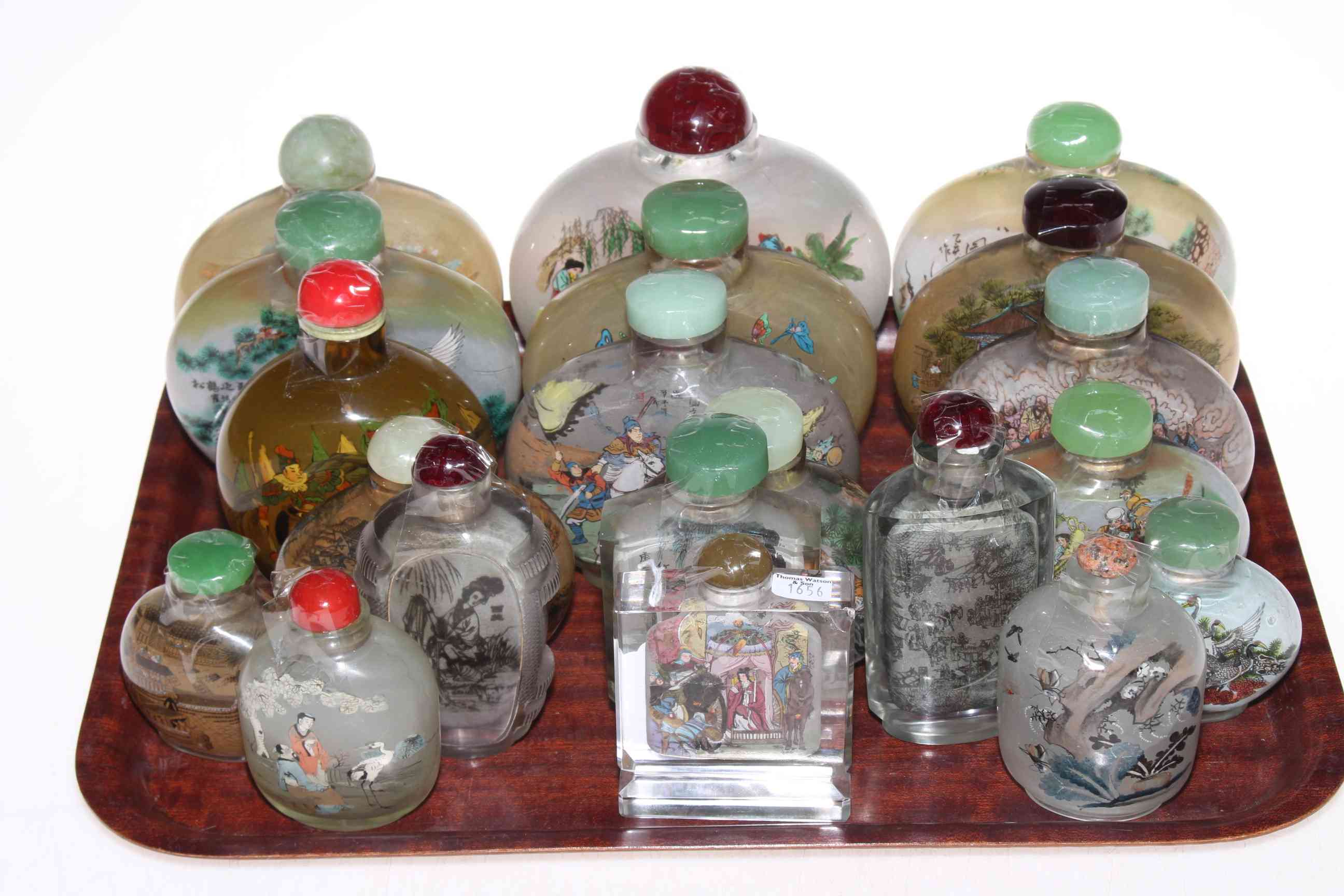 Collection of twenty Chinese glass snuff bottles.