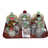 Collection of twenty Chinese glass snuff bottles.