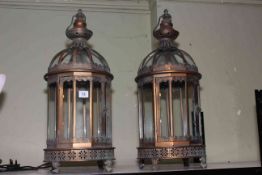 Pair of metal and glazed hanging lanterns, approximately 62cm high.